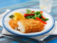 Breaded fish with vegetables — Stock Photo