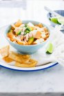 A bowl with Mexican chicken tortilla soup — Stock Photo