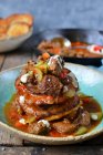Potato pancakes with beef in a homemade sauce — Stock Photo