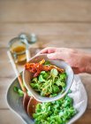 Lambs lettuce with fig and mustard dressing, and bacon — Stock Photo