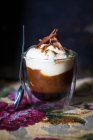A glass of coffee with cream and chocolate — Stock Photo