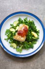 Pan fried cod loin with steamed greens and chilli jam — Stock Photo