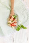 Quinoa with strawberries, rhubarb and basil on wooden spoon — Stock Photo