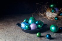 Easter background with painted Easter eggs in vintage style over dark background — Stock Photo