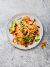 Bucatini with vegetable and tomato pesto, dried tomatoes, carrots, courgettes and parsley — Stock Photo