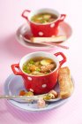 Alphabet soup with mini sausages and toast — Stock Photo