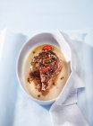 Veal cutlet with sage, tomatoes, salt, pepper and cheese sauce — Stock Photo