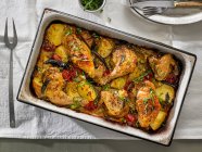 Chicken Baked With Yukon Gold Potatoes, Cherry Tomatoes and Herbs — Stock Photo
