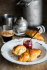 Homemade croissants with jam and coffee — Stock Photo