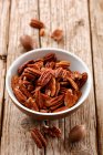 A bowl of pecan nuts — Stock Photo