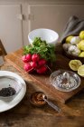 Radishes and kitchen prep — Stock Photo