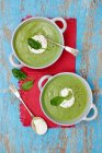 Spinach and broccoli soup with creme fraiche — Stock Photo