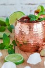 Moscow Mule cocktail in copper mug with mint and lime — Stock Photo