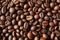 Unground coffee beans pattern — Stock Photo