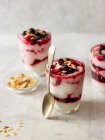 Yogurt with honey, berries and almond flakes — Stock Photo