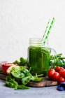 Green smoothie of apple, baby spinach, cucumber and chia seeds — Stock Photo