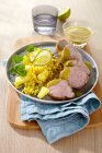 Pork fillet with pineapple rice and coriander leaves — Stock Photo