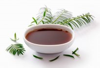Spruce tip syrup in a small bowl — Stock Photo