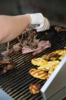 Lamb chops and vegetables on a grill — Stock Photo