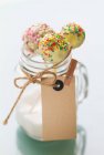 Cake pops with a white chocolate glaze and sugar beads — Stock Photo