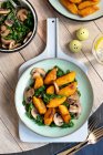 Sweet potato gnocci with spinach and mushrooms vegan dish — Stock Photo