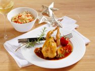 Greek-style quail with pilau rice and a tomato and olive sauce — Stock Photo