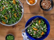 Kale and Sugar Snap Pea Salad with Dried Apricots and Crumbled Feta Cheese — Stock Photo