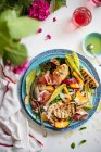 Mixed leaves salad with cured ham, nectarines, Parmesan and grilled bread — Stock Photo