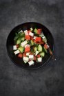 Watermelon salad with feta cheese, cucumbers, mint and lime dressing - foto de stock