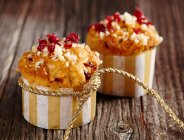 Pecan nut and cranberry muffins in paper cases — Stock Photo