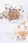 Easter bread with currants and pecans, decorated with ribbon — Stock Photo