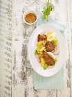 Fried goose liver with lettuce, egg, spring onions, radishes and a wild garlic dressing — Stock Photo