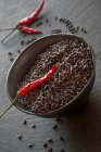 Black rice with dried chilli peppers — Stock Photo