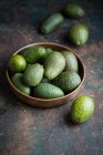 Fresh green avocado on wooden background — Stock Photo