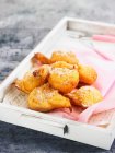 Bunuelos doughnuts from Spain on a wooden tray — Stock Photo