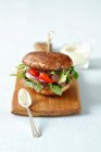 Portobello burger with grilled beef, red pepper and gherkins — Stock Photo
