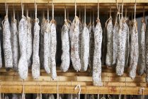 Fuet sausages hanging up (air-dried hard sausage from Catalonia) — Stock Photo