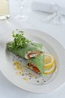 Spinach pancakes with smoked salmon and fresh cheese — Stock Photo