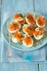 Eggs with smoked salmon, caviar and shoots — Stock Photo
