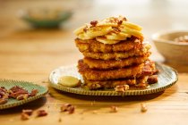 Pancakes with bananas, nuts and honey — Stock Photo