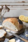 A white, home made loaf, flavoured with Amalfi lemon and poppy seeds — Stock Photo