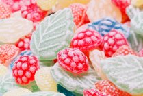 Colorful candy background. close up of frozen strawberries. — Stock Photo