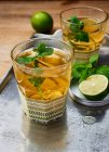 Hot Hugos with lime in glasses — Stock Photo