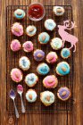 Biscuits with colorful icing and nuts, top view — Foto stock