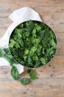 A bowl of fresh spinach — Stock Photo