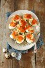 Eggs with smoked salmon, caviar and shoots for Easter — Stock Photo