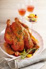 Roasted capon with a pepper and tomato medley — Stock Photo