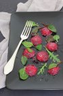 Close-up shot of delicious Beetroot ravioli with mixed salad leaves — Stock Photo