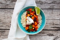 Chili sin carne with black sesames seeds on bed of rice — Stock Photo