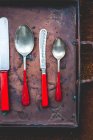 Kitchen utensils and spoons on a wooden background — Stock Photo